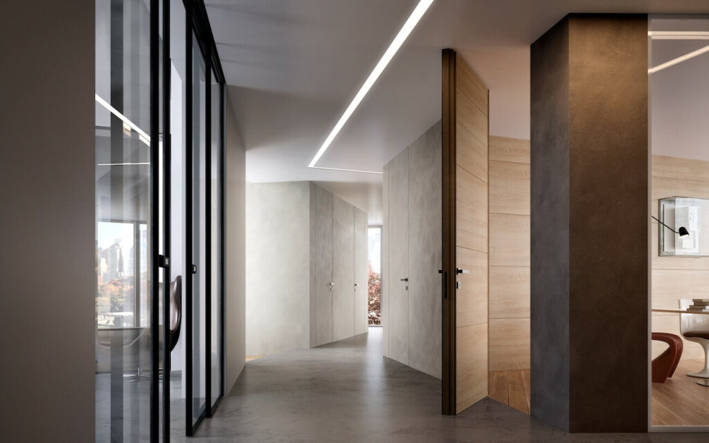 Porta Filomuro versione Bilato con anta abbinata alla boiserie in rovere